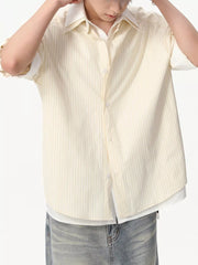 Yellow striped cotton blend button-up shirt with short sleeves and a white underlayer.