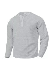 Light gray waffle knit henley t-shirt with button placket and long sleeves.