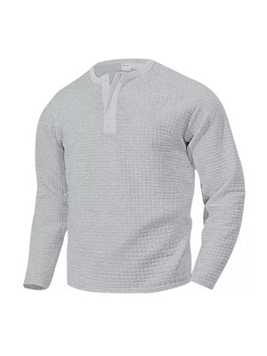 Light gray waffle knit henley t-shirt with button placket and long sleeves.
