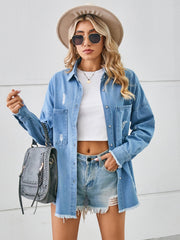 Light blue oversized denim overshirt with distressed detailing and frayed hem.