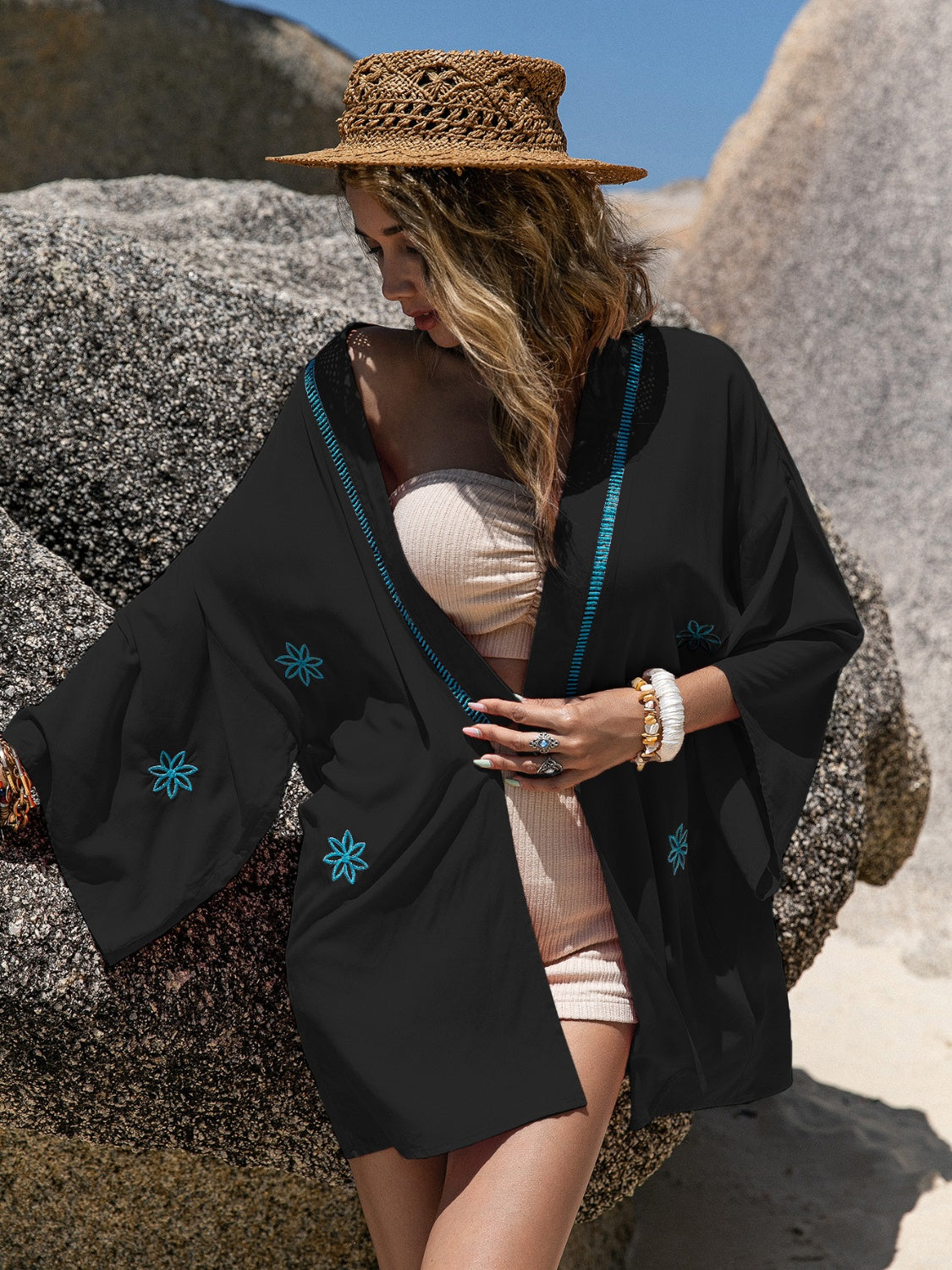 Black embroidered kimono cover-up with contrast stitching and floral details.