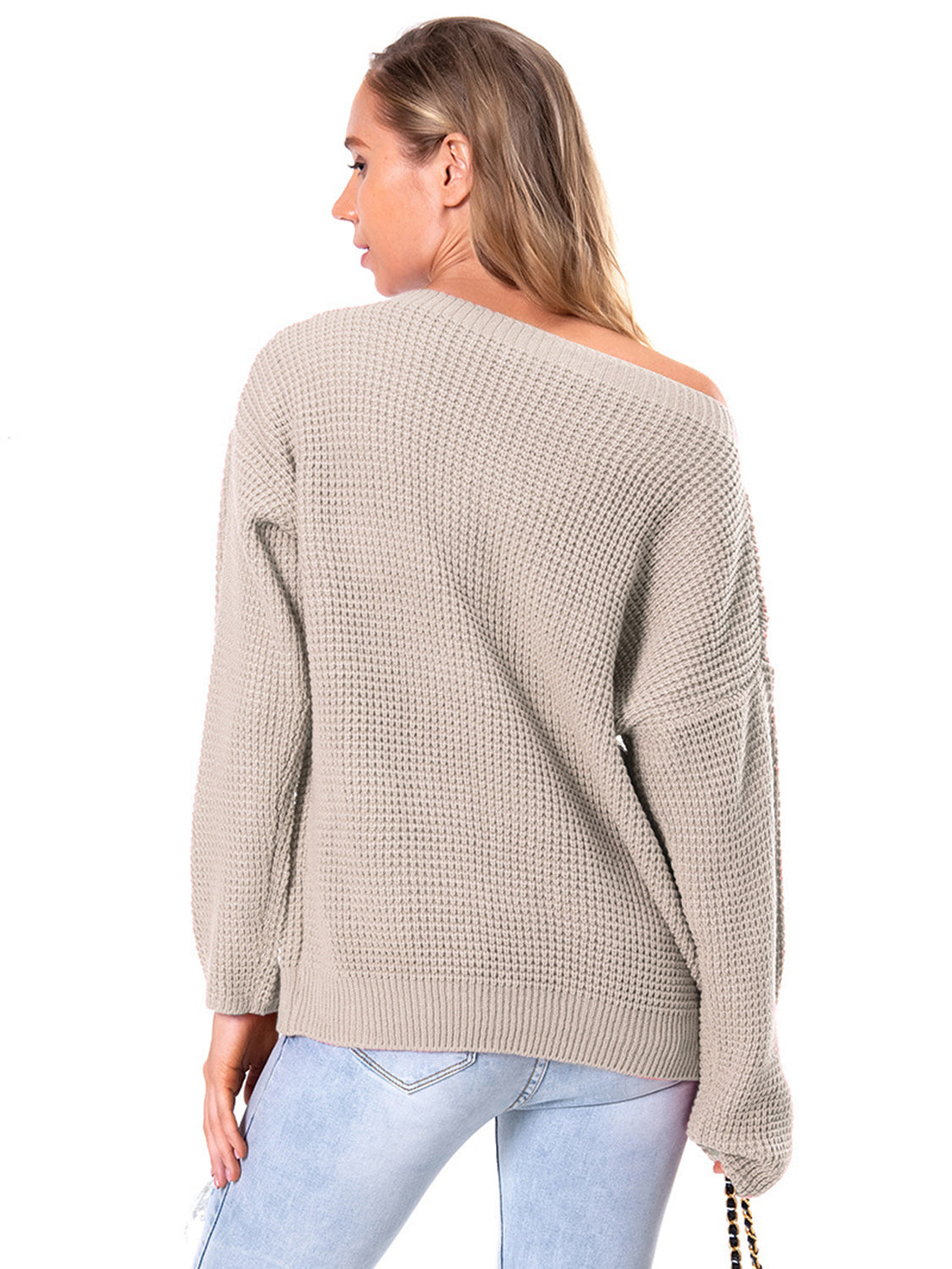 Off-shoulder waffle knit sweater in beige acrylic with a slouchy fit and boat neckline.