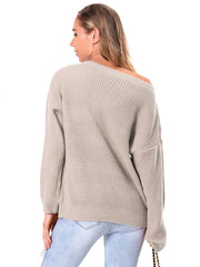 Off-shoulder waffle knit sweater in beige acrylic with a slouchy fit and boat neckline.