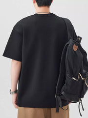 Oversized black cotton blend men's t-shirt with crew neck and short sleeves.