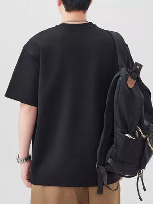 Oversized black cotton blend men's t-shirt with crew neck and short sleeves.