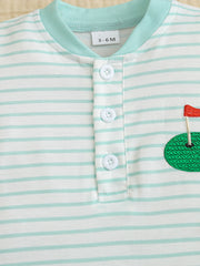 Baby bodysuit with mint stripes, golf applique, and button placket.