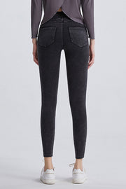 Dark gray denim leggings with faux pockets and a slim fit.