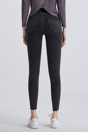 Dark gray denim leggings with faux pockets and a slim fit.