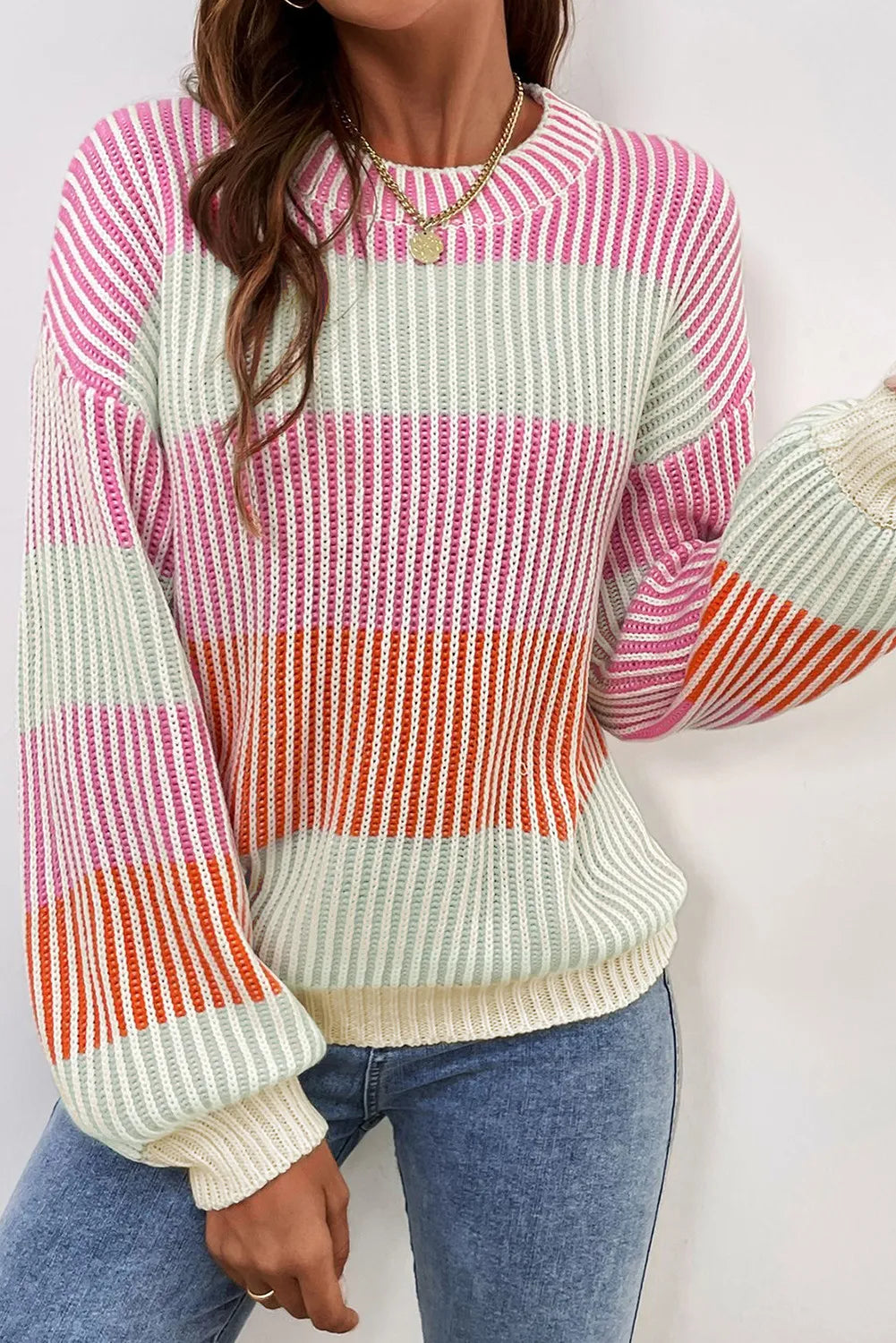 Ribbed stripe knit sweater with balloon sleeves in pink, orange, and mint green stripes.