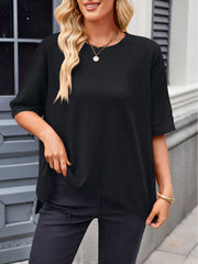 Black relaxed fit t-shirt with drape sleeves and crew neck, styled casually.