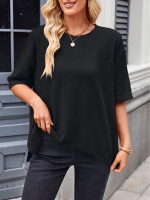 Black relaxed fit t-shirt with drape sleeves and crew neck, styled casually.