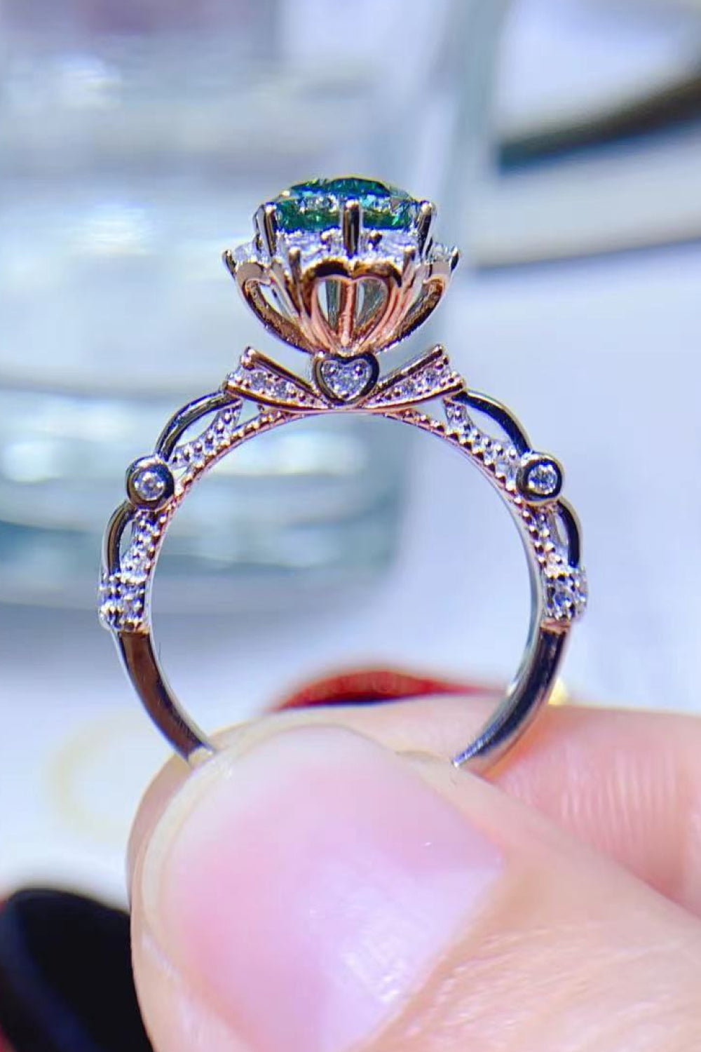 Emerald Bloom Moissanite Halo Ring in 925 sterling silver with light green center stone and diamond accents.