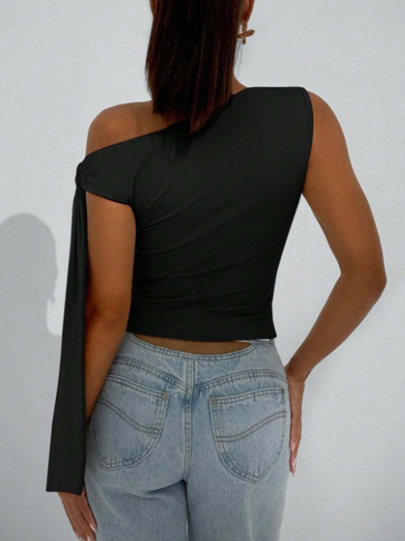 Black asymmetrical tie detail cropped blouse with one long sleeve