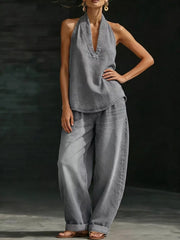 Gray halter neck top and wide-leg pants outfit set with deep V-neck and ankle cuffs.