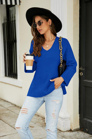 Royal blue relaxed fit v-neck knit pullover sweater with ribbed details and bell sleeves.