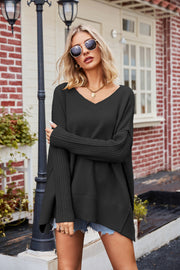 Black acrylic v-neck sweater with ribbed sleeves and asymmetric hemline