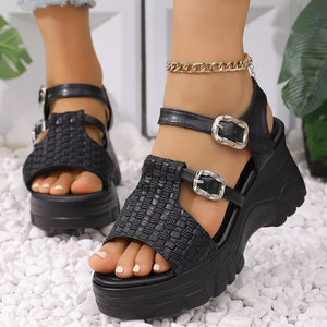 Black woven texture high wedge sandals with adjustable buckle straps and chunky platform heel.
