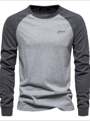 Colorblock raglan tee in gray and dark gray with a crew neck and embroidered logo.