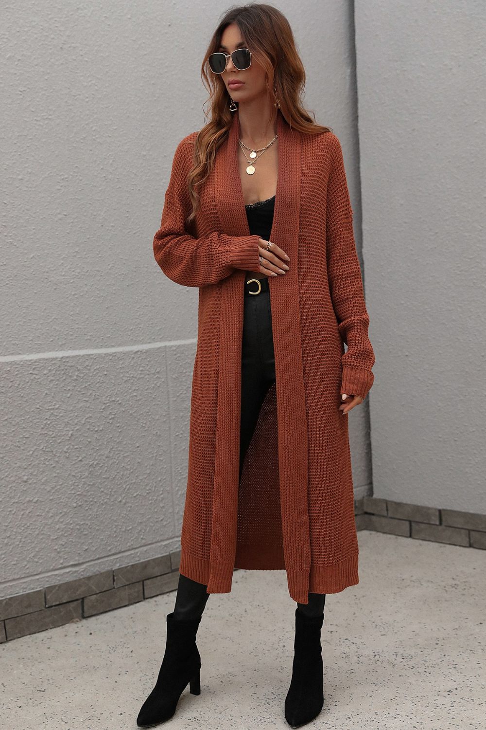 Brown textured knit maxi cardigan with open front and long sleeves.