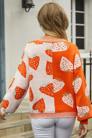 Orange and pink acrylic cardigan with strawberry print, crew neck, long sleeves.