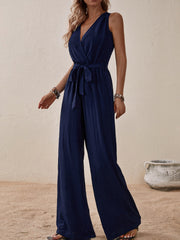 Navy textured wrap-front wide-leg jumpsuit with tie waist and V-neck