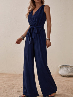 Navy textured wrap-front wide-leg jumpsuit with tie waist and V-neck
