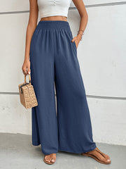 Dusty blue textured palazzo lounge trousers with smocked waist and wide leg.