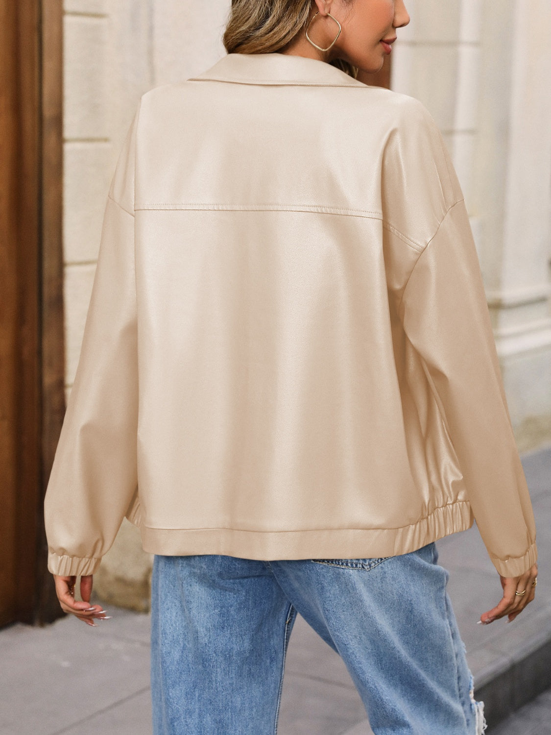 Earthy faux leather bomber jacket in tan with a relaxed fit and elasticated cuffs and hem.