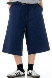 Navy blue relaxed fit bermuda shorts with pockets and belt loops.