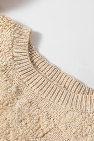 Beige textured checkerboard knit sweater with crew neck and ribbed details