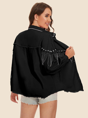 Black denim trucker jacket with fringe and pearl embellishments, frayed hem