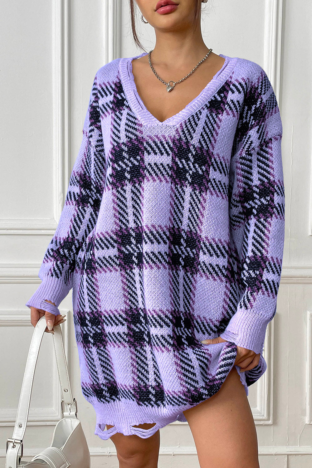 Distressed hem plaid knit mini dress in pastel yellow with V-neck and long sleeves.