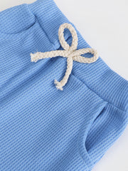 Blue cotton waffle knit pants with drawstring and pockets