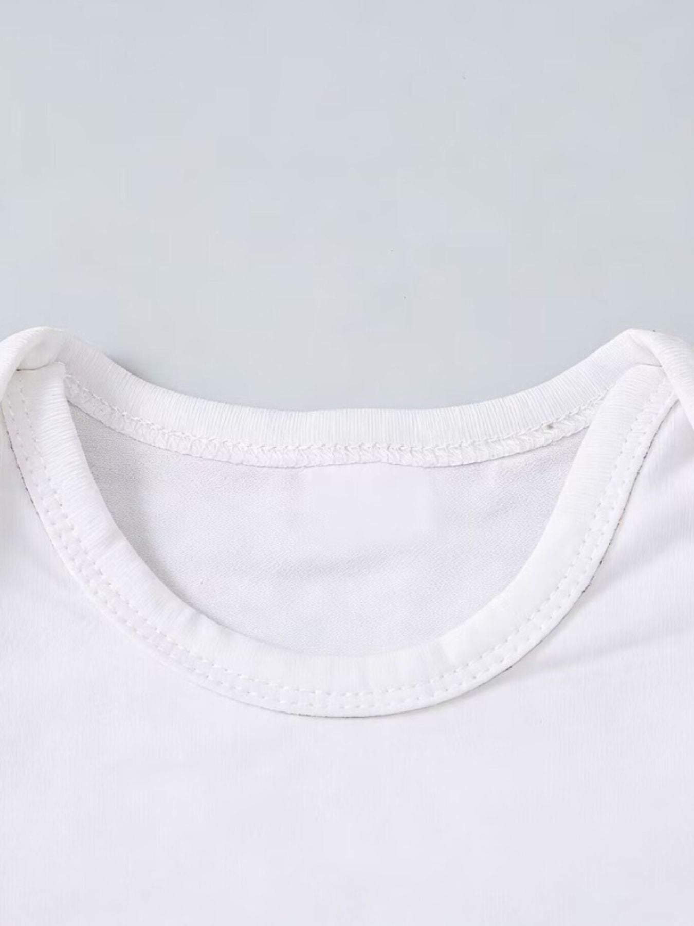 White baby bodysuit with a rounded neckline and contrast stitching.
