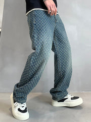 Relaxed fit blue denim jeans with allover textured pattern and vintage wash.