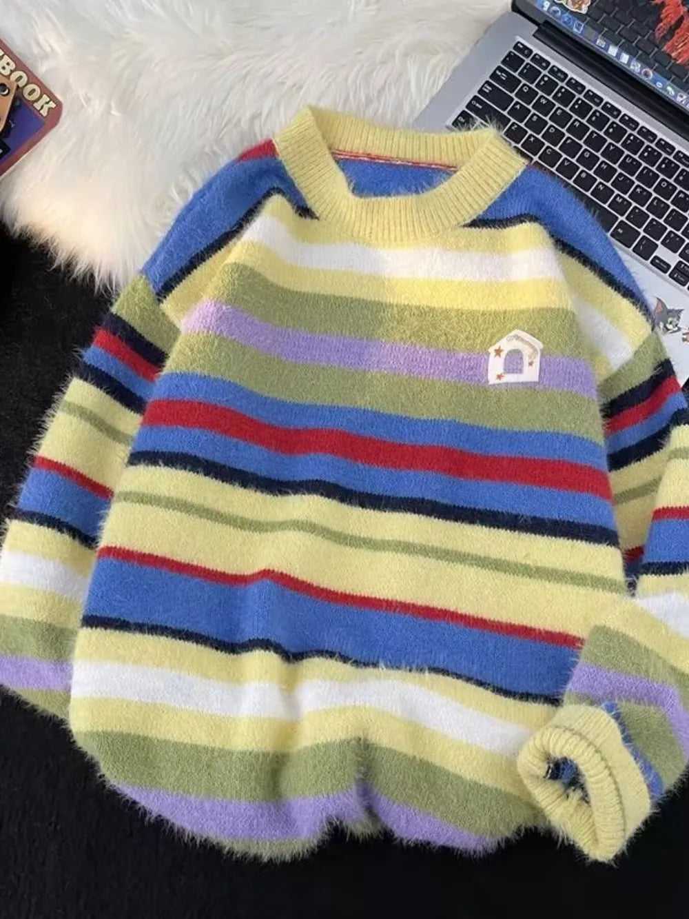 Cozy multi-striped knit sweater for him with a house patch detail.