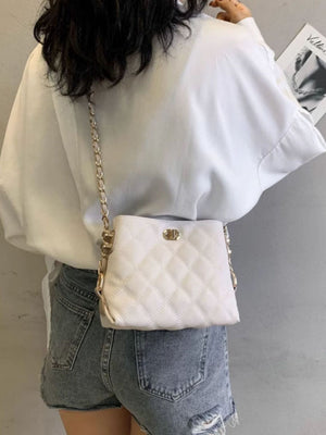 White quilted pu leather crossbody bag with gold chain strap and clasp detail