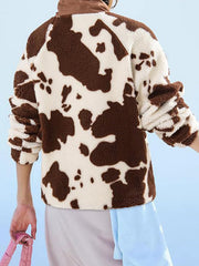Cow print sherpa button-up jacket with brown accents and a cozy texture.