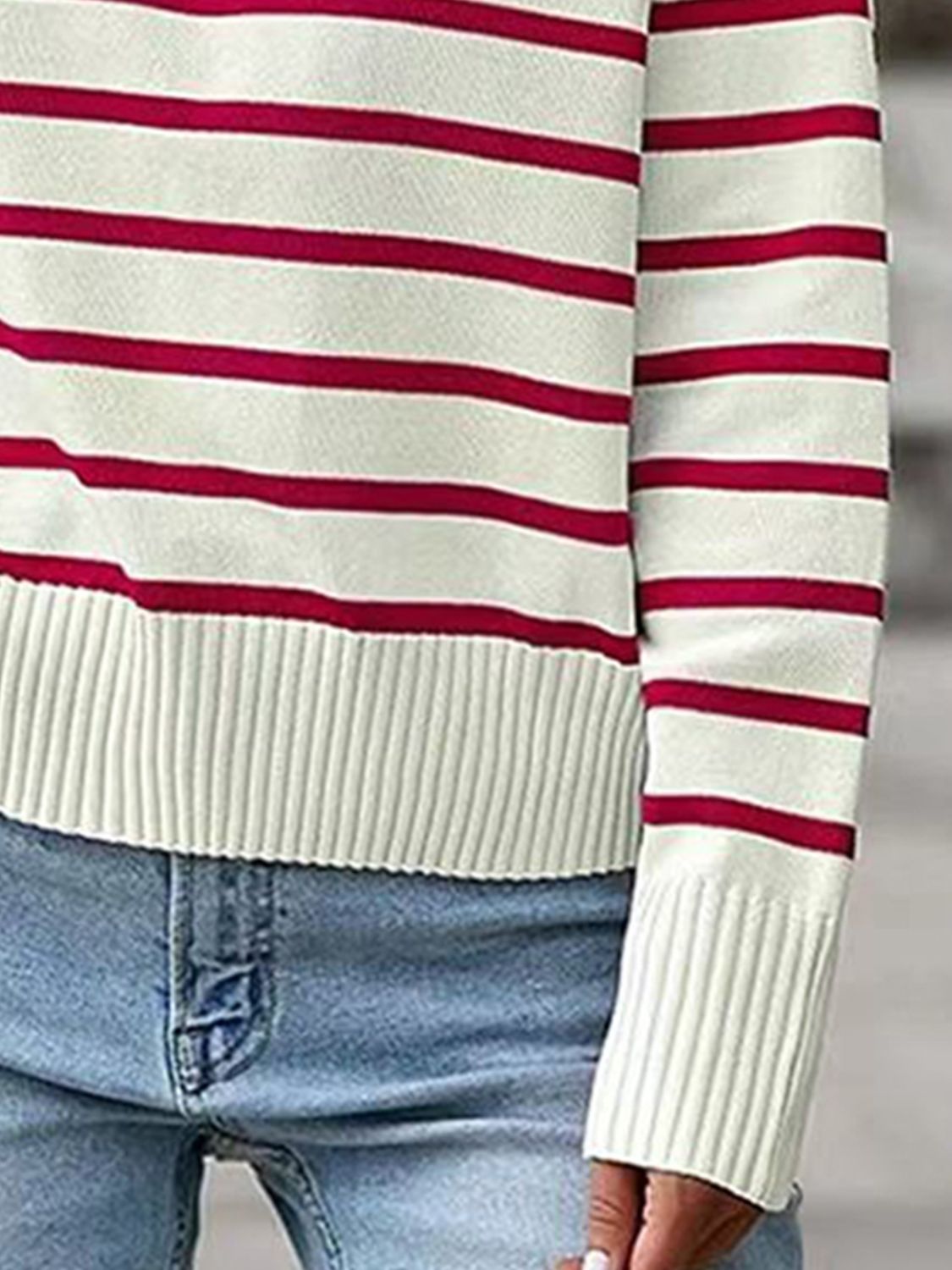 Striped polo knit sweater with burgundy stripes and ribbed cuffs and hem.