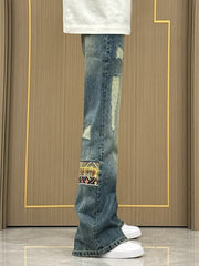 Distressed blue wash wide-leg jeans with patchwork details and ripped accents.