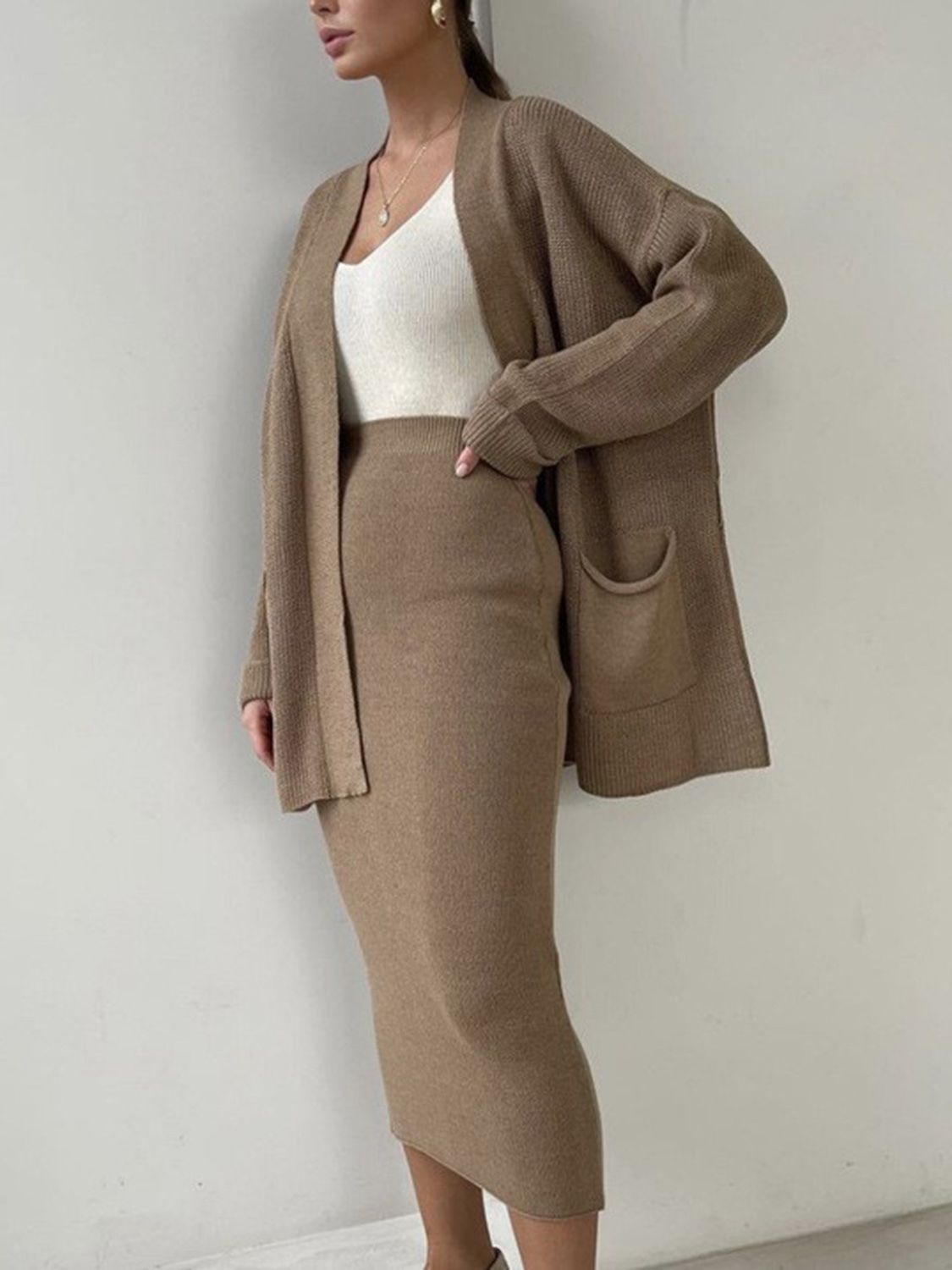 Camel ribbed knit cardigan and midi skirt set with pockets, acrylic material.
