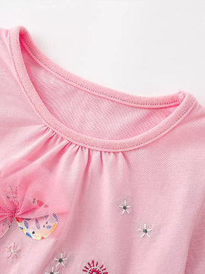 Pink cotton t-shirt with embroidered flowers and a tulle bow detail.