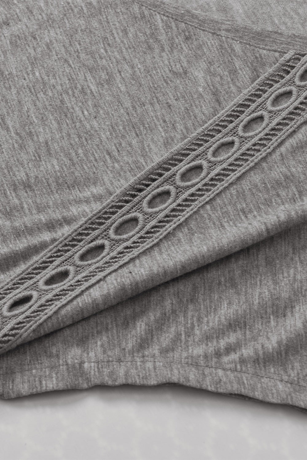 Dark Gray dolman sleeve tunic with lace inset detail on the sleeve.