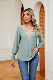 Mint green eyelet blouse with lace trim V-neck and ruffle cuffs
