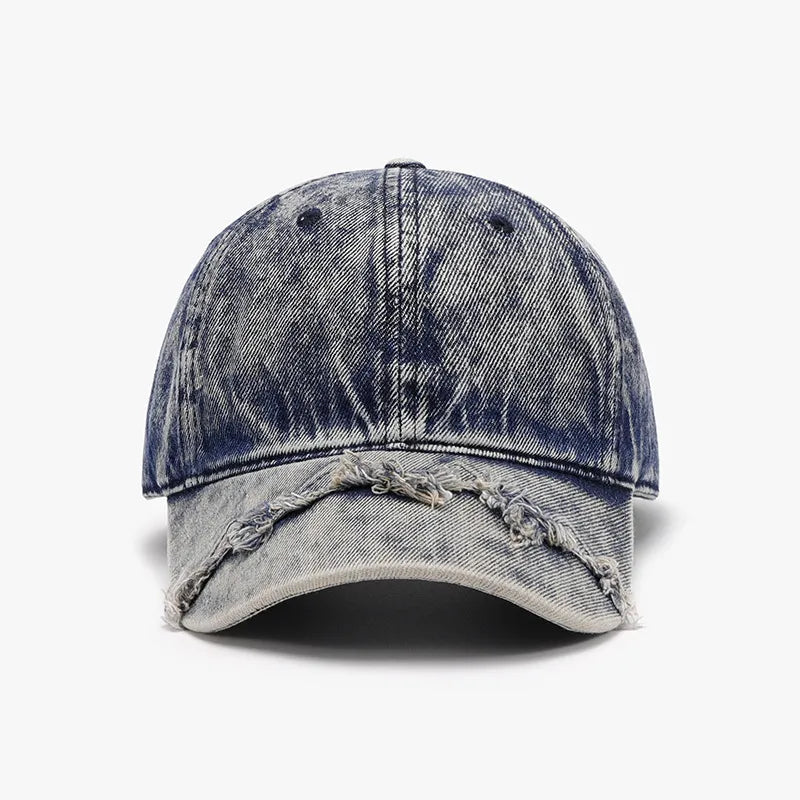 Acid wash distressed baseball cap in Indigo with frayed brim detail.