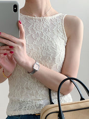 White sheer lace tank top with floral pattern and round neckline.