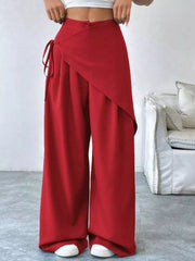 Red maternity wide-leg trousers with a wrap-style front and tie detail.