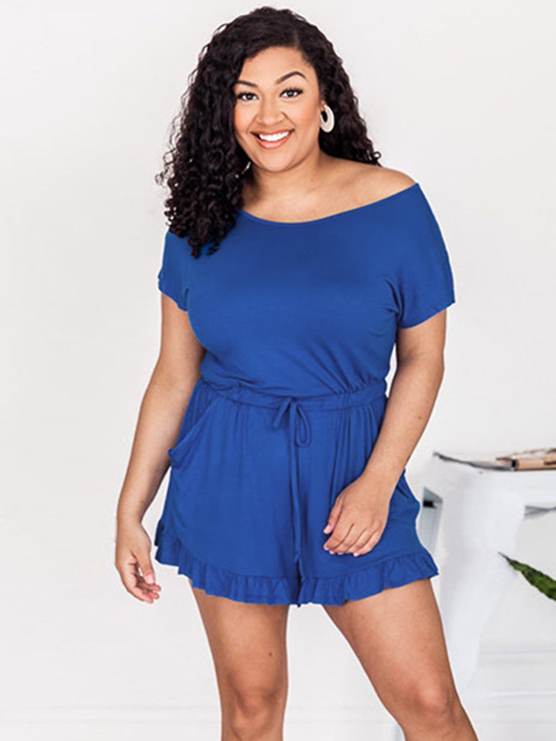 Royal blue off-shoulder romper with ruffle hem and drawstring waist