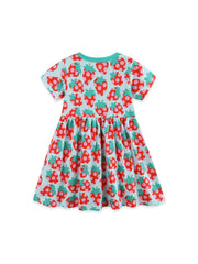Baby dress with allover strawberry print, short sleeves, and gathered skirt.