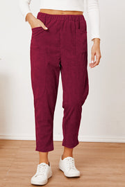 Corduroy barrel-leg utility pants in Scarlet with elastic waist and patch pockets.